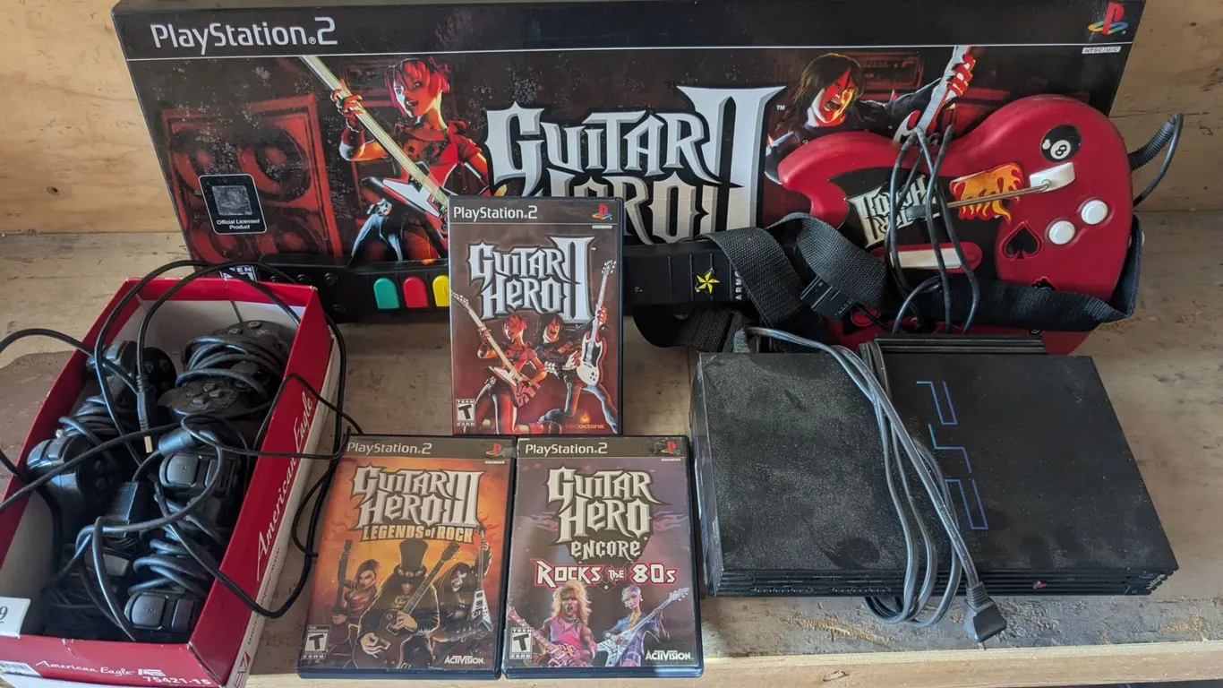 PS2 w/ Network Card, Controllers, and Guitar Hero Bundle (Not Tested)