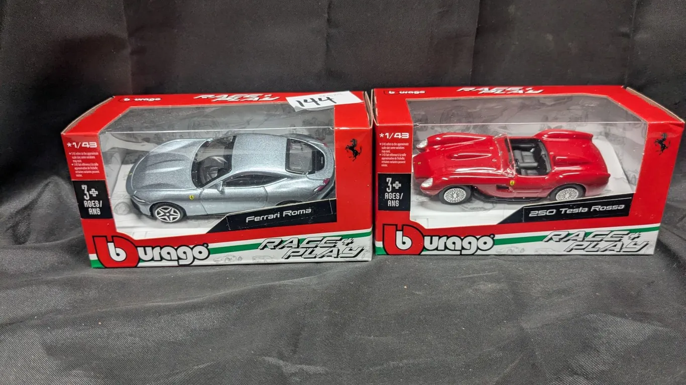 Toy ferrari and roadster