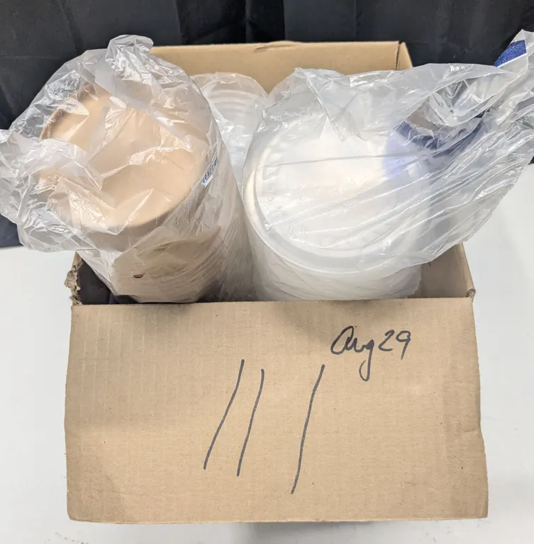 Plastic and paper food storage/take out containers, with some lids