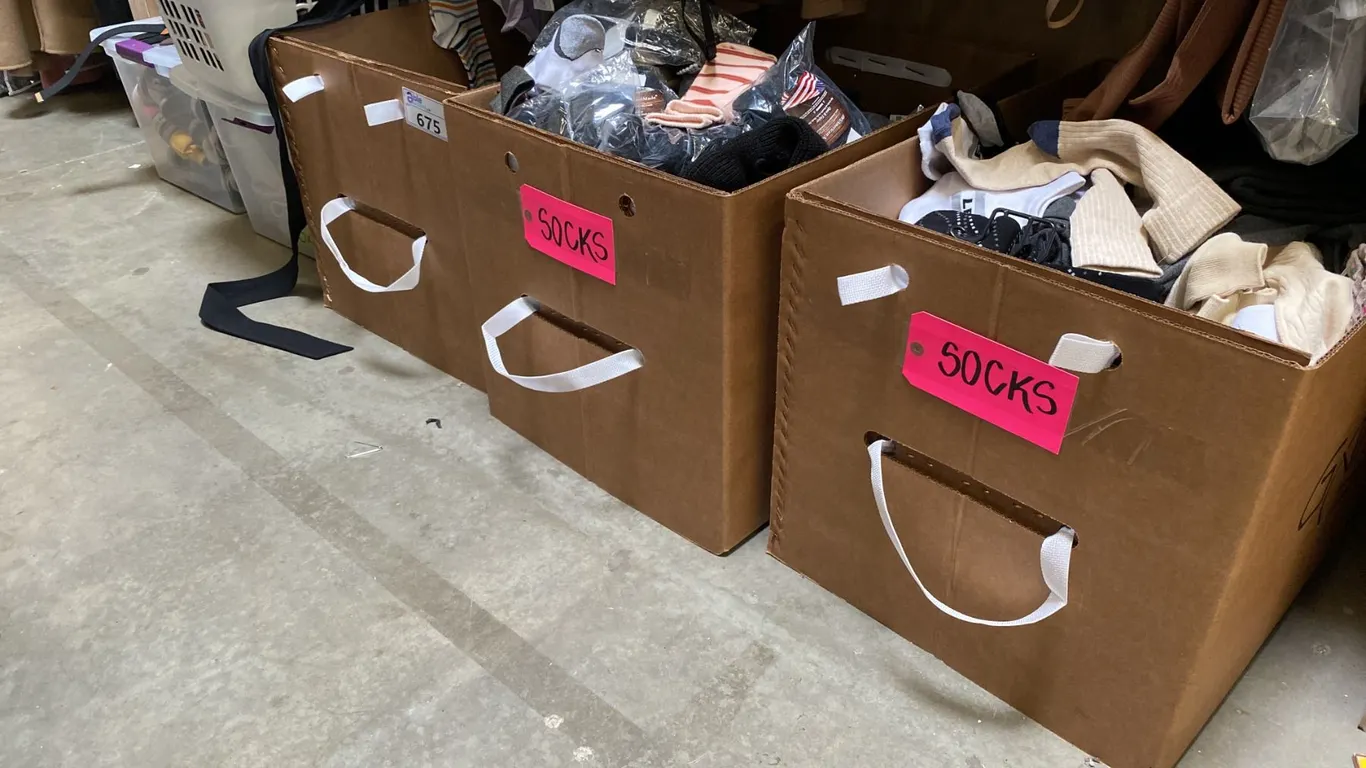 4 BOXES OF ASSORTED SOCKS AND 2 BOXES OF SHOES