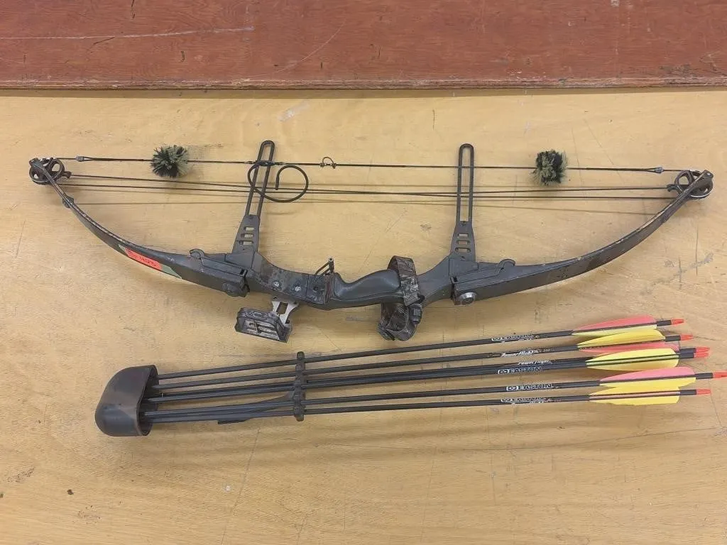 vintage multi-cam compound bow with arrows