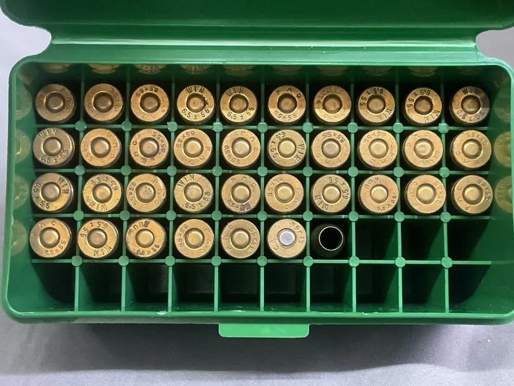 Thirty-seven Winchester 6.5mm x 55 cal. brass in