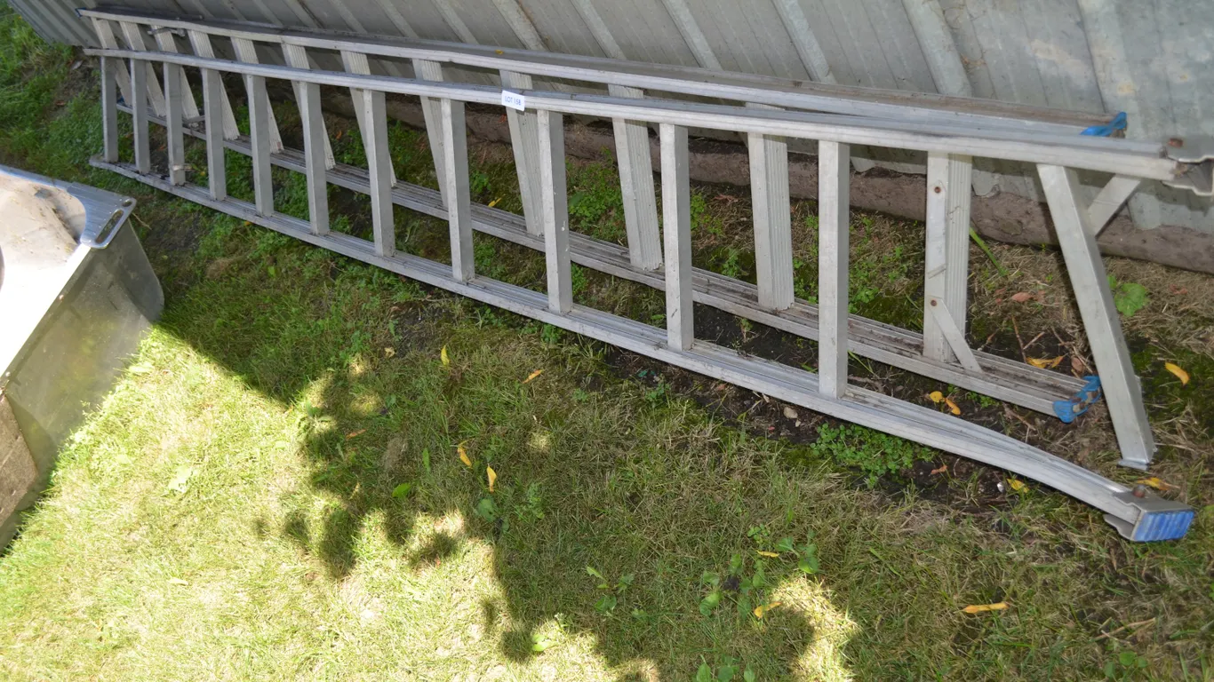 2 - 10' Ladders, one has a broken rung at the bottom
