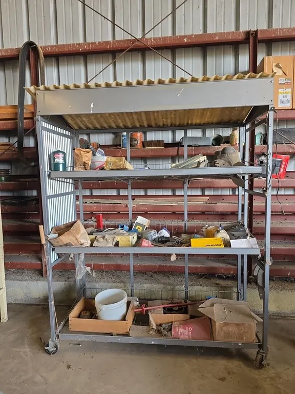 Steel organizing cart on caster wheels with contents