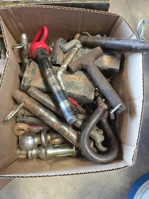 Box of hitch pins, reciever hitches and clevices