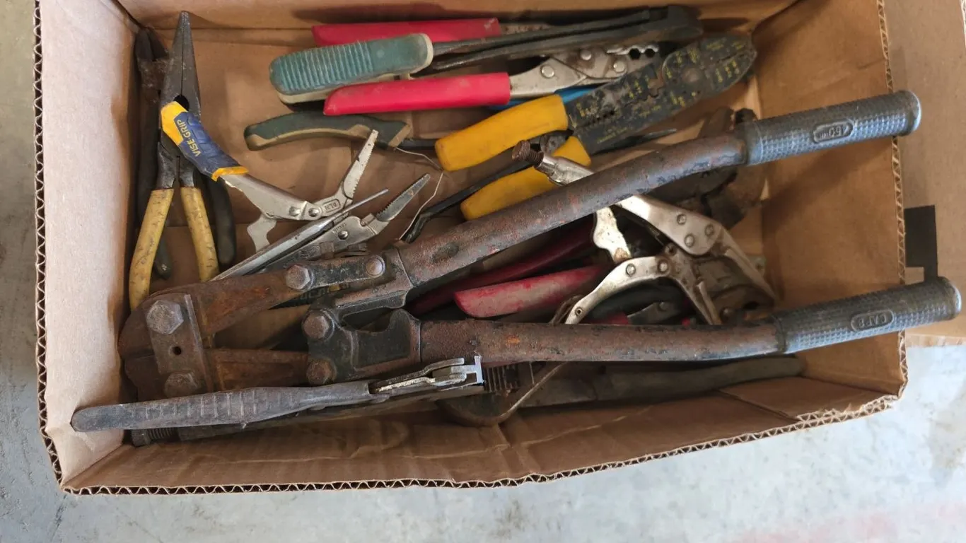 Box of bolt cutter, wire strippers and channel locks