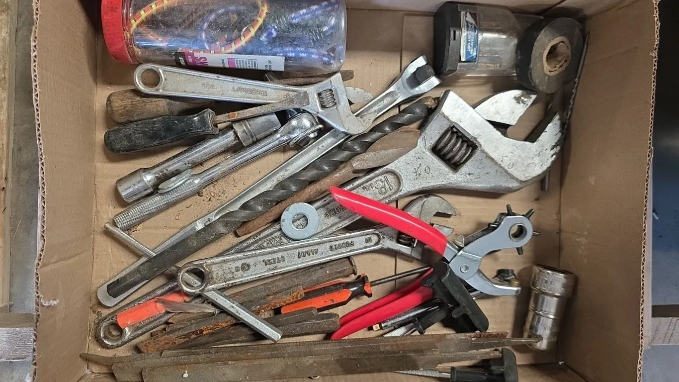 Box of 18" crescent wrench, smaller crescent wrenches, breaker bar, ratchet, chisels