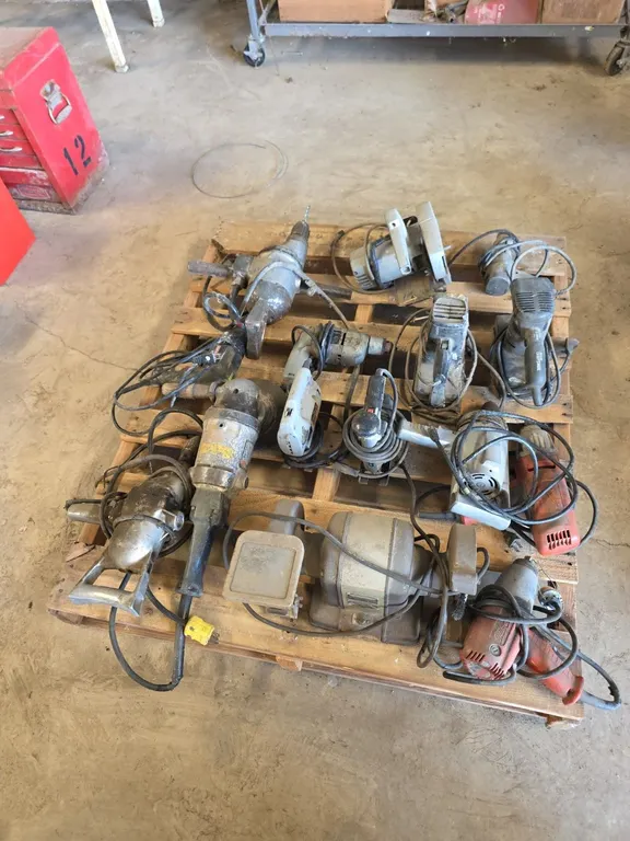 Pallet of power tools and bench grinder