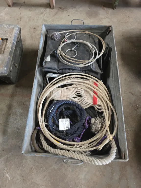 Galvanized tub of horse tack, leed ropes and lariats