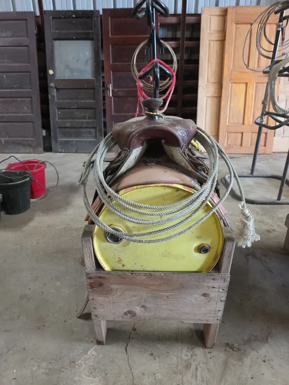 Saddle and lariat on saddle stand