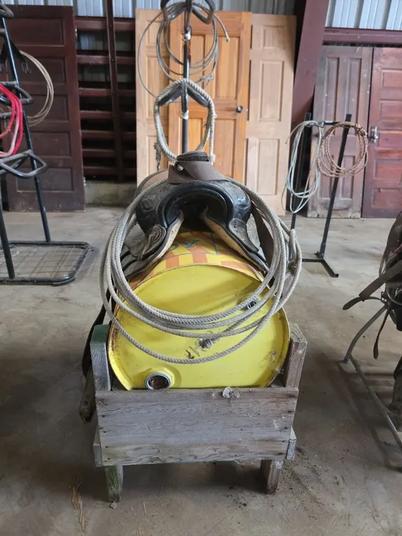 Saddle and lariat on saddle stand