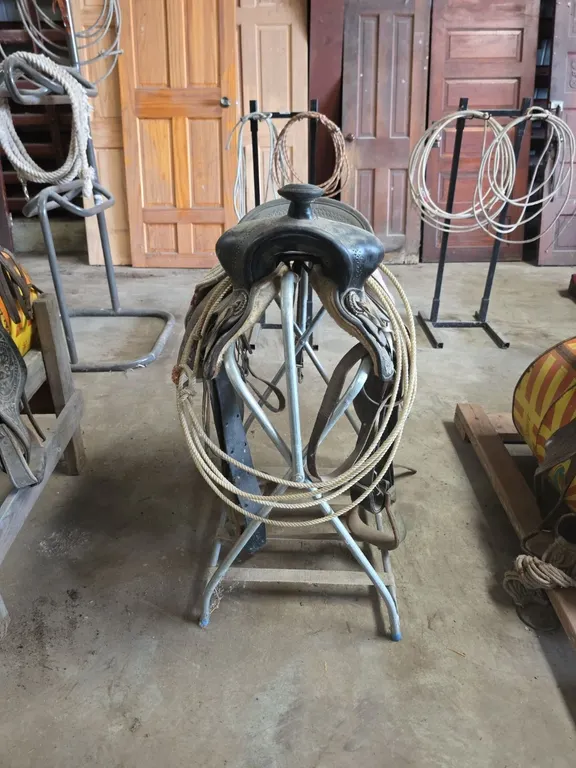 Saddle and lariat on saddle stand