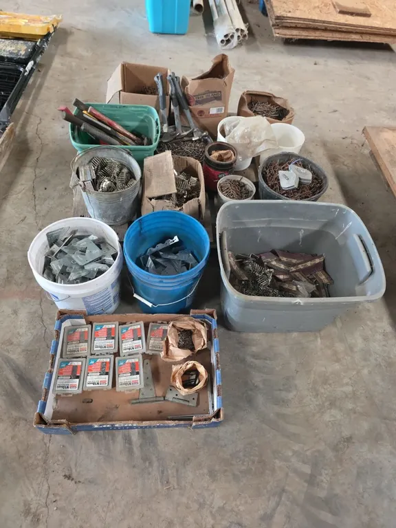 Large quantity of nails hardware and hammers