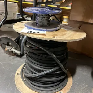 2 - PARTIAL ROLLS OF NEW/UNUSED 1 1/6" STEEL CABLE & 1-0 WELDING CABLE