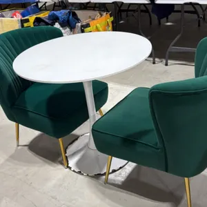 Pedestal table and (2) accent chairs. Includes 31.5" round white pedestal table and (2) green fabric upholstered accent chairs. Chairs feature channel