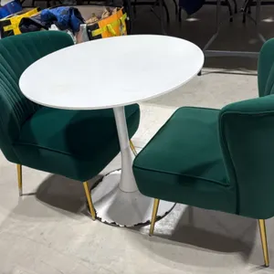 Pedestal bistro table with (2) accent chairs. Includes 31.5" round white top pedestal table and (2) 22"W green fabric channel-tufted chairs with gold-