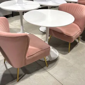 Pedestal table and chair set. Includes (1) white round pedestal table and (2) pink upholstered accent chairs. Chairs feature channel-tufted backrests 