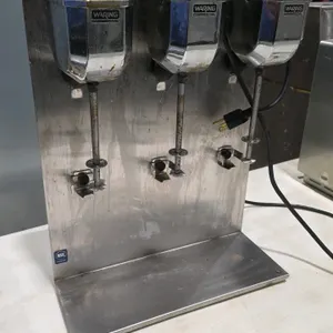 Waring Commercial 3-head malt mixer. Features 3 motorized mixing spindles with agitating discs, stainless steel splash panel and base, cup rests, and 