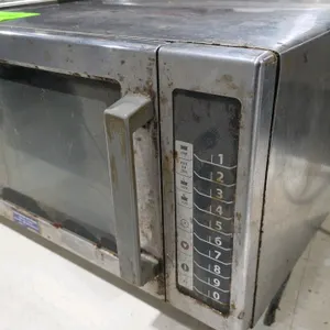 2015 Amana RCS10TS commercial microwave oven. Features stainless steel construction, 10-button digital control panel, and grab handle door. S/N: 15056