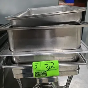 Stainless steel chafing dish sets. Each set includes a wire chafing stand and stainless steel pans.