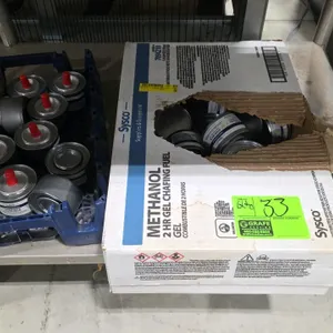 Quantity of assorted chafing fuel cans. Includes Sysco stem wick chafing fuel and Sysco 2-hour methanol gel chafing fuel in open box and plastic crate