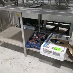 Stainless steel work table. Features a stainless steel undershelf and 6 tubular legs. 60" x 30". Note: Tabletop features pre-drilled mounting holes. C