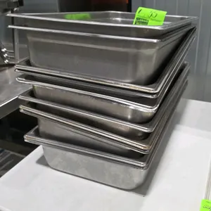 Stainless steel steam table pans. Includes full-size 4"D pans and (2) half-size pans.