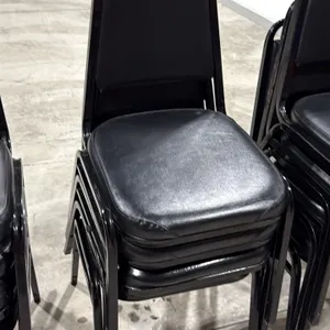 Stacking banquet chairs. Features black vinyl padded seats and backrests on black metal frames. Stackable design.