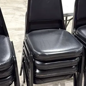 Stackable banquet chairs. Features black vinyl padded seats and backrests with black metal frames.
