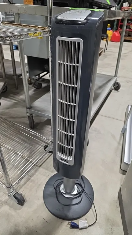 Lasko 2510 oscillating tower fan. Features 3-speed settings, timer controls, top push-button control panel, and a circular pedestal base. Electrical:
