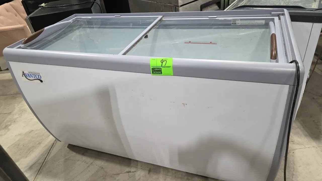 2022 Avantco 360DFF16HCL self-contained display freezer. Features sliding curved glass lids and white exterior finish. Approx. 60"L. S/N: DFF161120220