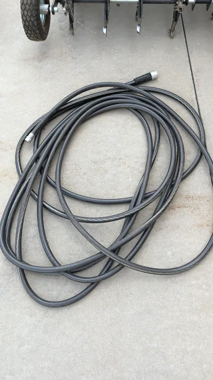 Poly garden hose. Features threaded metal hose end fittings with strain relief collar. 50'L. Aerator in background not included.