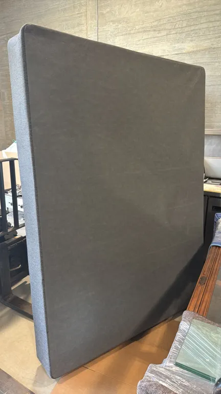 Queen size box spring foundation. Features gray fabric upholstery with protective backing. 60"W x 79"L.