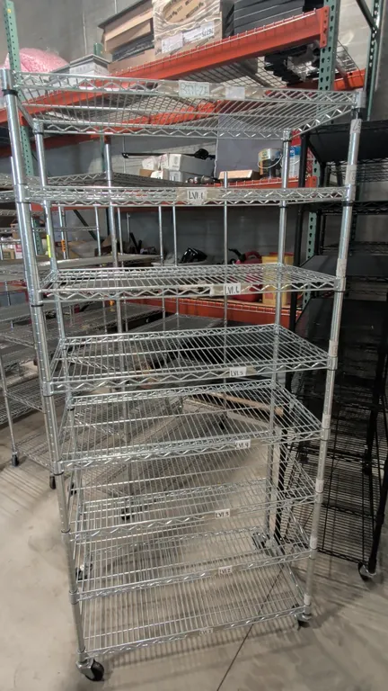 Seville Classics 8-tier chrome wire shelving rack. Features 8 adjustable wire shelves and NSF certification. 36"W x 18"D x 76"H. Mounted on casters.
