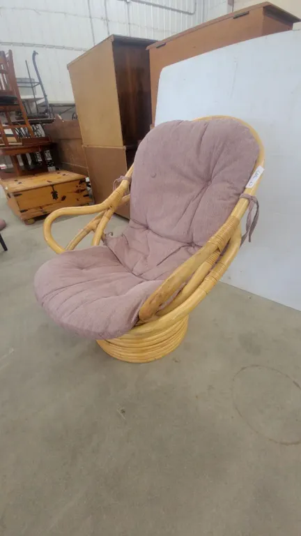 Rattan Swivel Chair with Mauve Cushion