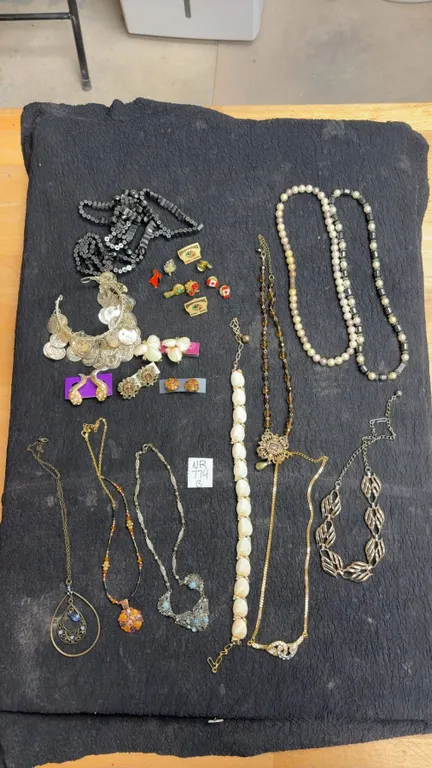 Assortment of Vintage Costume Jewelry Including Necklaces, Clip On Earrings, Charm Bracelet, and