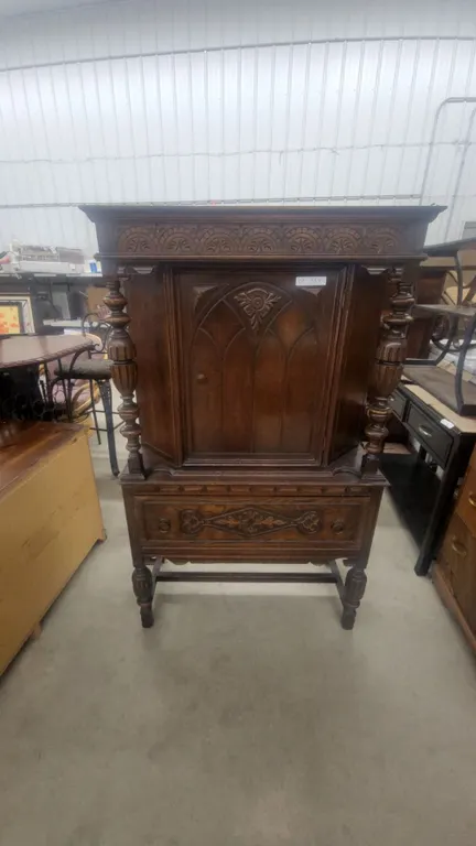 Carved Oak Corner Cabinet with Spindle Supports and Decorative Frieze 64”×37”×18”