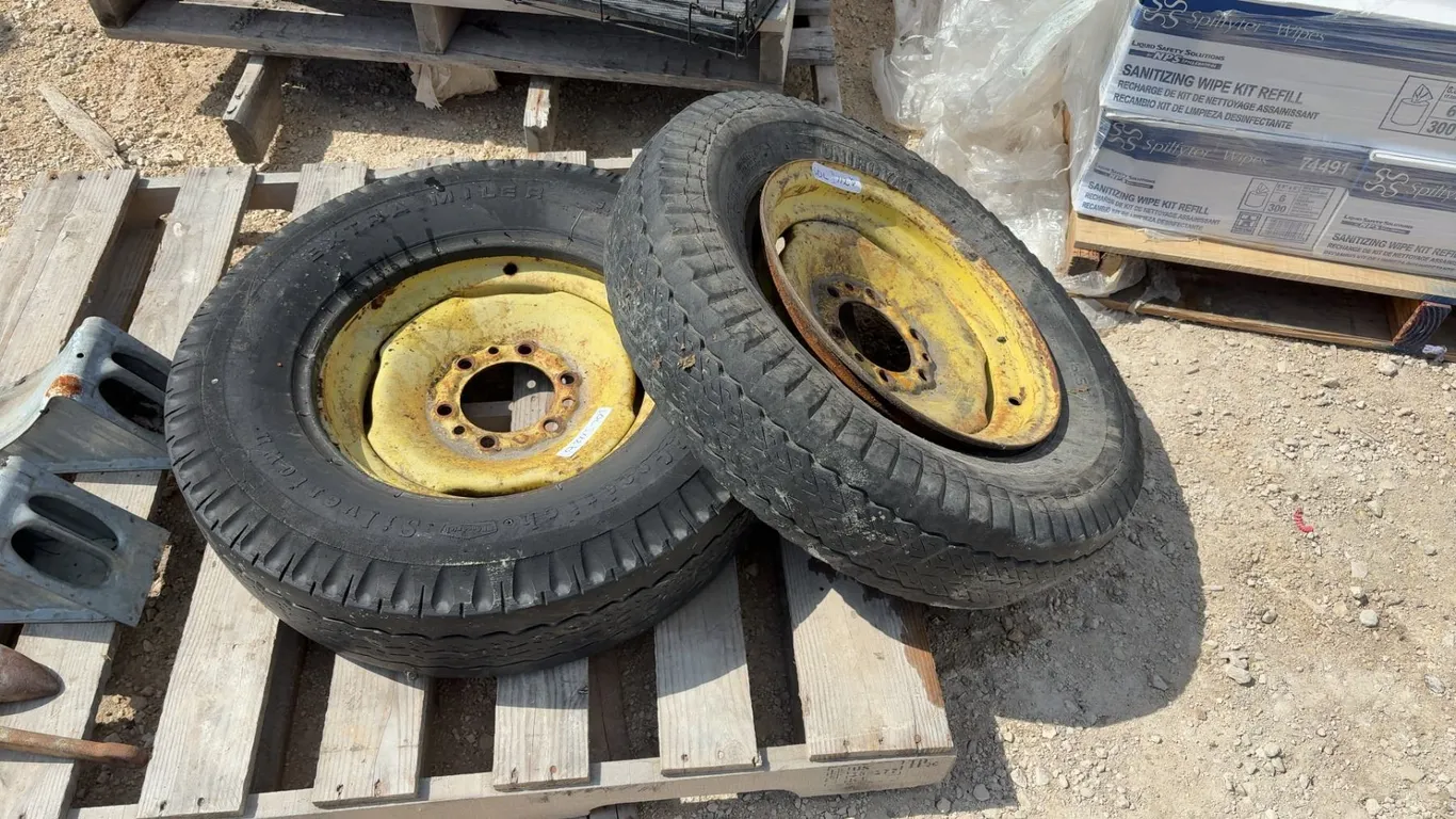 Pair of John Deere Front Fleetmaster Triple Tread 6.50-16LT Tires Mounted on Yellow Steel Rims