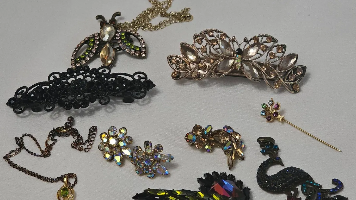 Nine Mixed Costume Jewelry Brooches, Clips, and Pendants