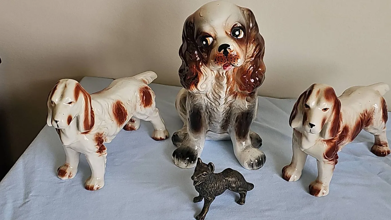 3 Ceramic Dog Figurines and 1 Metal Dog Figurine