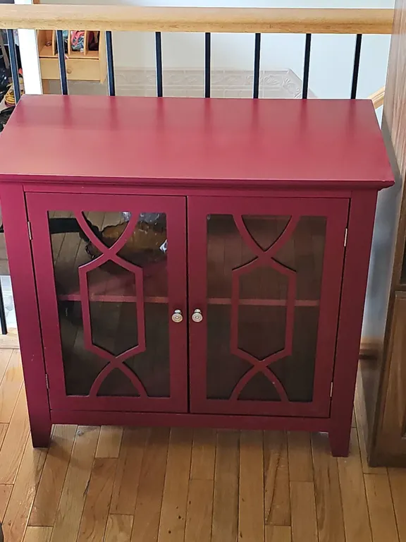 Red Wooden Cabinet With Glass Pane Double Doors