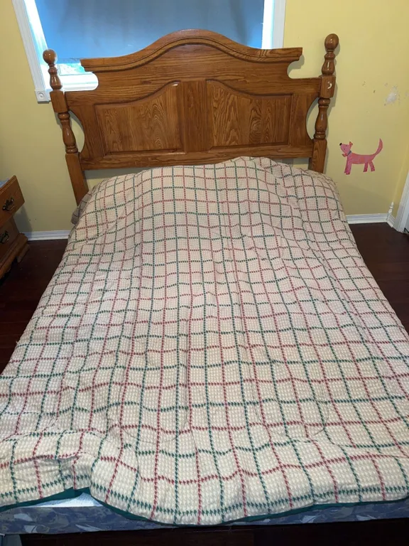 Oak Headboard with Double Boxspring and Quilt