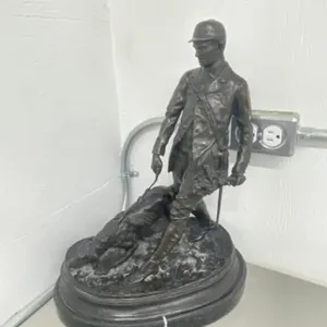 Figural Sculpture Depicting A Huntsman & Hound