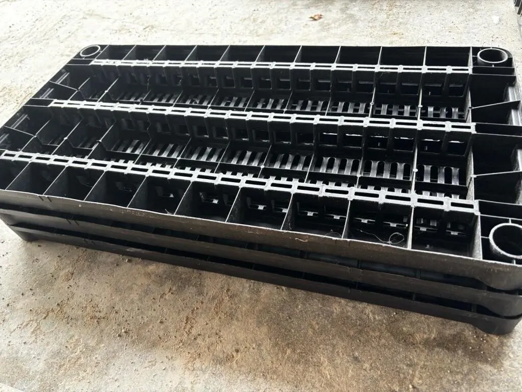 Black plastic storage shelf