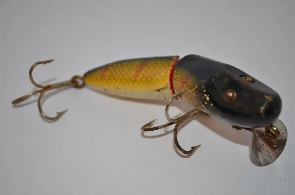 Wooden fishing lure is a classic jointed minnow