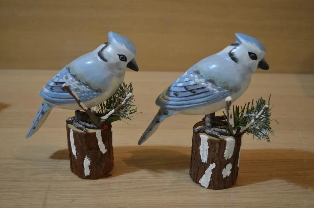 Hand-carved and hand-painted wooden blue jays