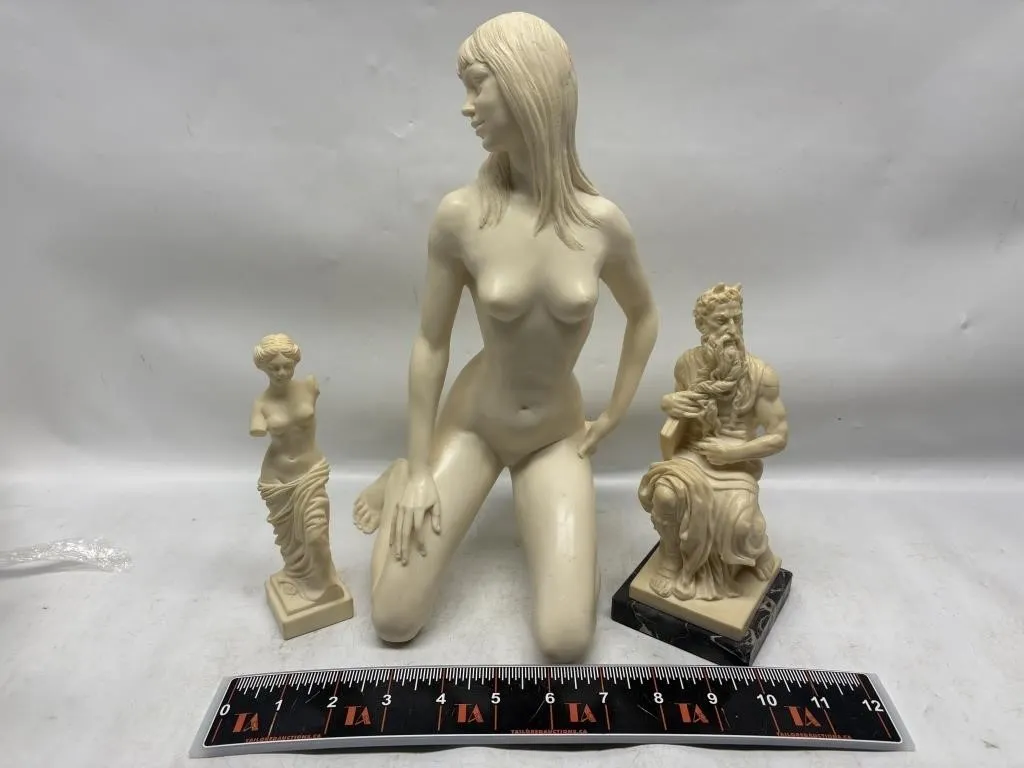 Three resin figural statues: nude woman, Venus de
