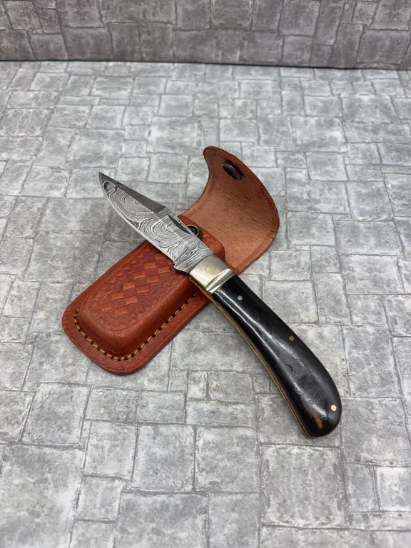 Damascus Steel Knife with Resin Handle and Leather Sheath