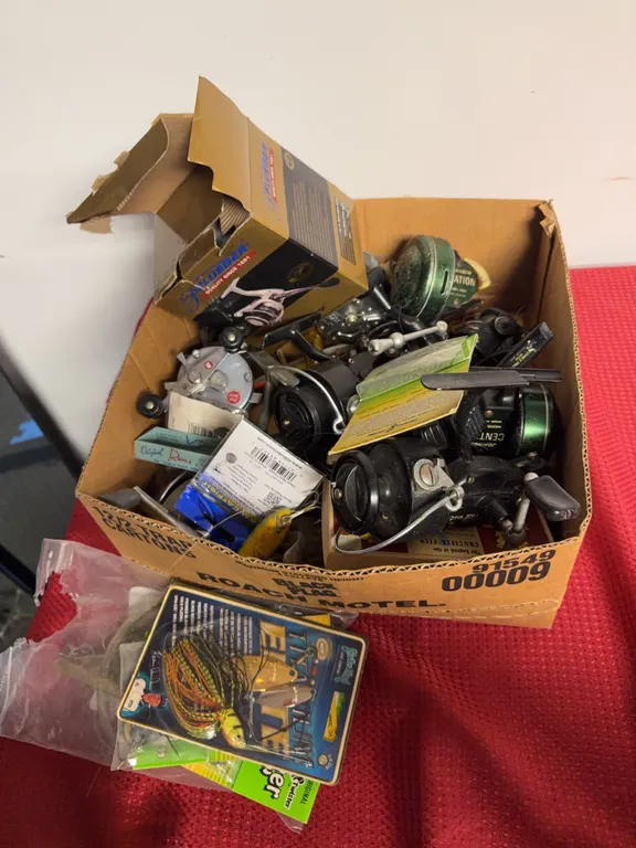 Box Of Fishing Supplies and Reels