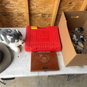 Lego case, stuffed dog, and conduit clamps
